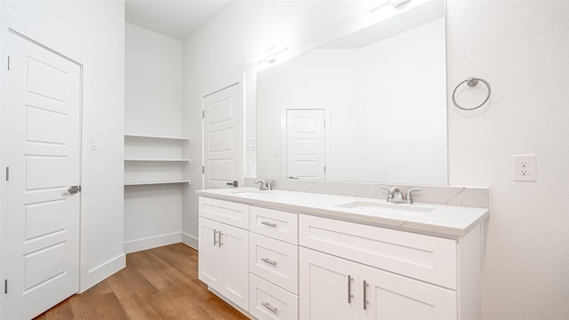 bathroom featuring hardwood / wood-style flooring and vanity