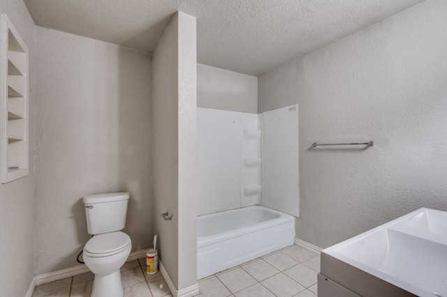 full bathroom with tile patterned flooring, vanity, toilet, and a textured ceiling