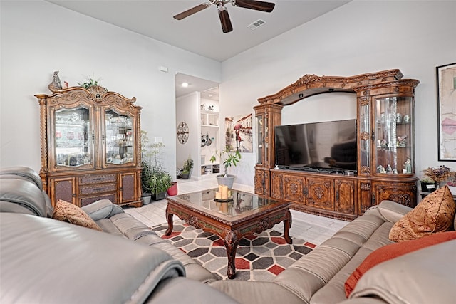 living room featuring light hardwood / wood-style flooring and ceiling fan