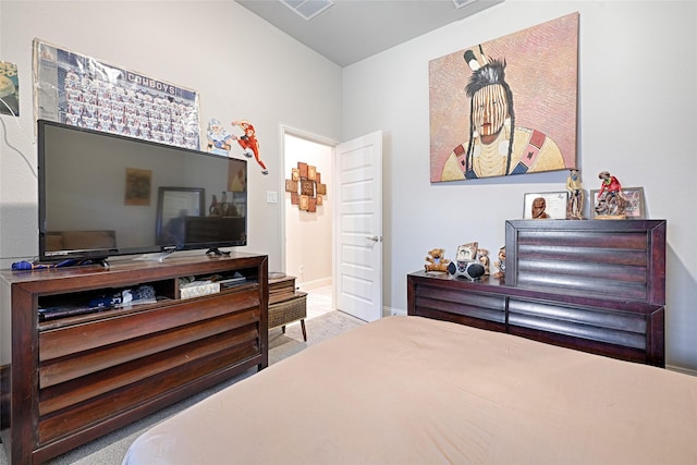 bedroom with light colored carpet