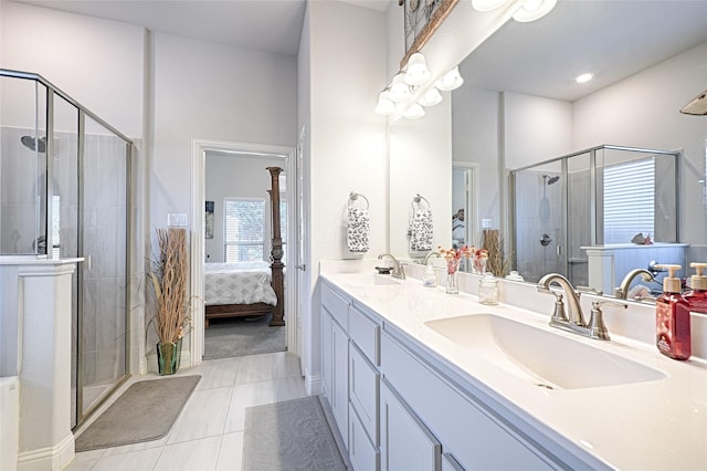 bathroom featuring vanity, tile patterned floors, and an enclosed shower