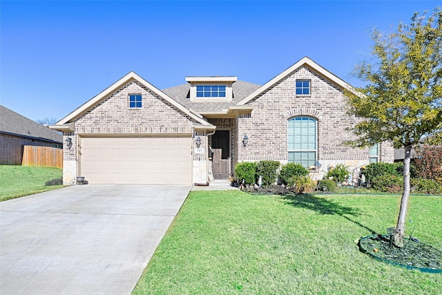 view of front of house with fence, a front lawn, brick siding, a garage, and driveway