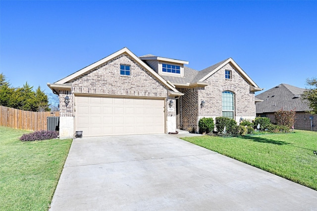 view of front of house with a front yard and a garage