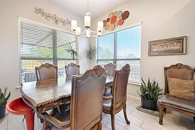 dining space with a notable chandelier