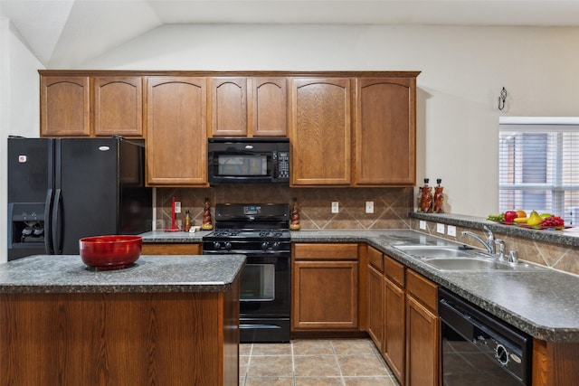 kitchen with sink, a center island, tasteful backsplash, lofted ceiling, and black appliances