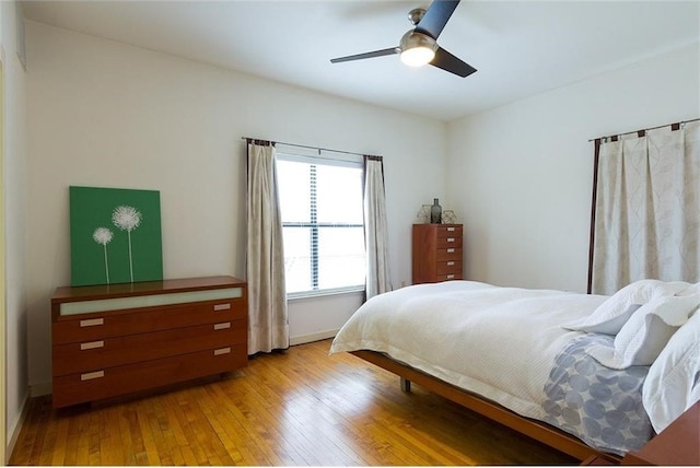 bedroom featuring light wood-type flooring and ceiling fan