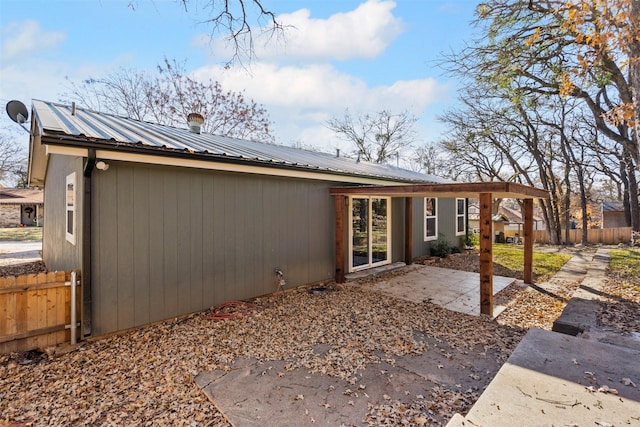 back of property featuring a patio area