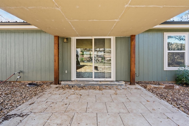 property entrance featuring a patio