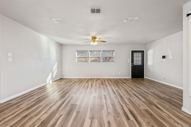 unfurnished living room with ceiling fan and light wood-type flooring