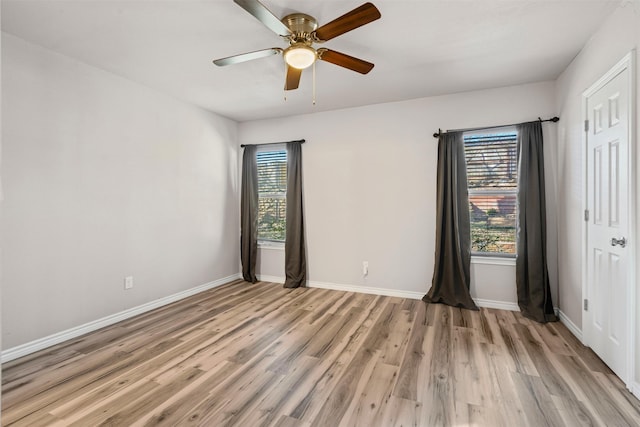 spare room with ceiling fan and light hardwood / wood-style floors