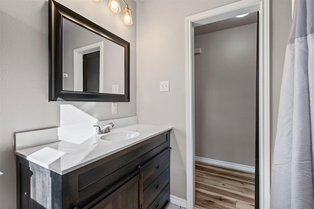 bathroom featuring wood-type flooring and vanity