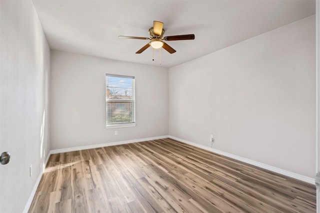 empty room featuring hardwood / wood-style floors and ceiling fan