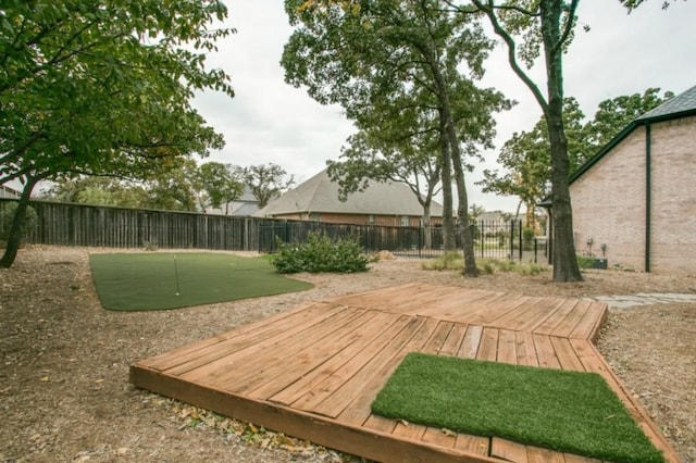1218 Hunters Haven Dr, Kennedale, TX 76060 - wooden terrace featuring a putting area and a fenced backyard