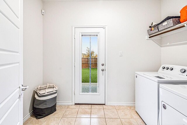 washroom featuring washer and dryer and light tile patterned floors