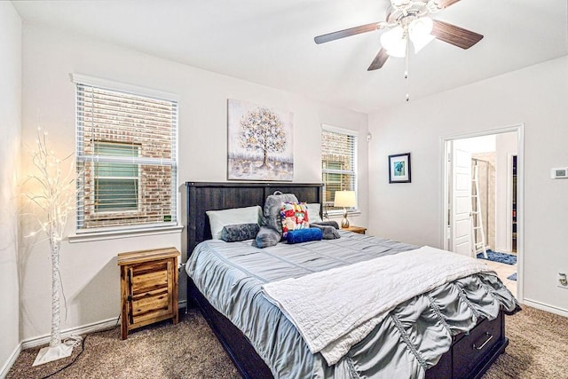 carpeted bedroom featuring ceiling fan and ensuite bathroom