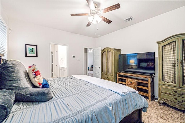 carpeted bedroom featuring ceiling fan and ensuite bathroom