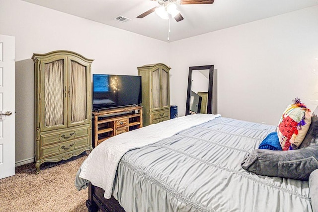 bedroom with light carpet and ceiling fan