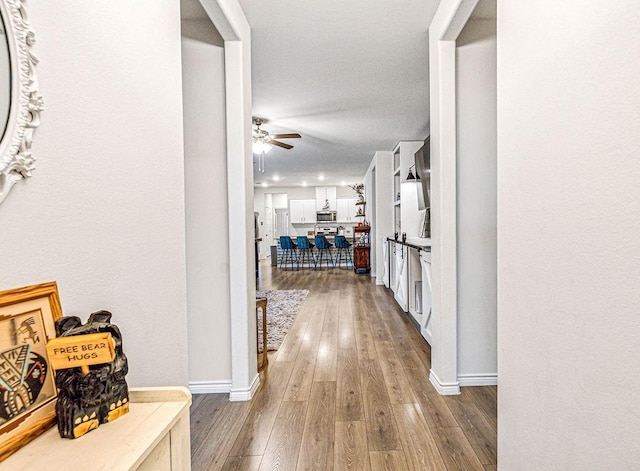 corridor featuring hardwood / wood-style flooring