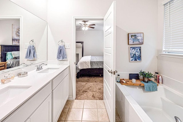 bathroom featuring a tub, ceiling fan, tile patterned flooring, and vanity