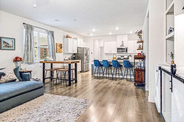 living room with light hardwood / wood-style floors