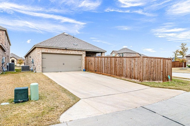 view of home's exterior with cooling unit and a garage