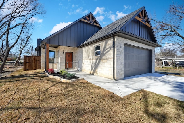 view of front of house with a front yard and a garage