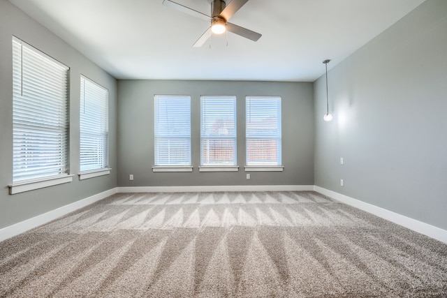 carpeted empty room with ceiling fan