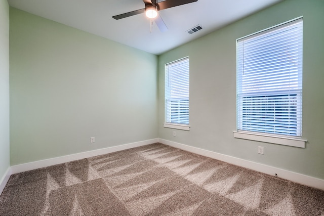 carpeted empty room with ceiling fan