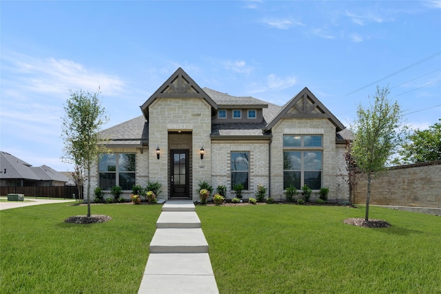 1402 Ethan Cir, Midlothian, TX 76065 - view of front facade with a shingled roof and stone siding