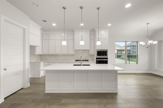 1402 Ethan Cir, Midlothian, TX 76065 - kitchen with oven, stainless steel microwave, decorative backsplash, light countertops, and recessed lighting