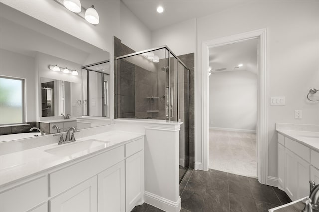 1402 Ethan Cir, Midlothian, TX 76065 - bathroom featuring a stall shower, a ceiling fan, two vanities, and recessed lighting