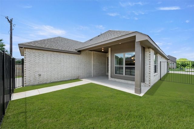 1402 Ethan Cir, Midlothian, TX 76065 - rear view of property featuring a shingled roof, brick siding, a patio area, and a gate