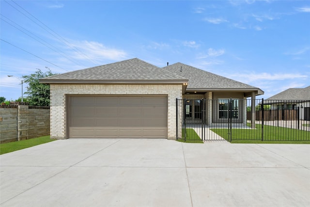 1402 Ethan Cir, Midlothian, TX 76065 - view of front of property with roof with shingles, concrete driveway, brick siding, and an attached garage