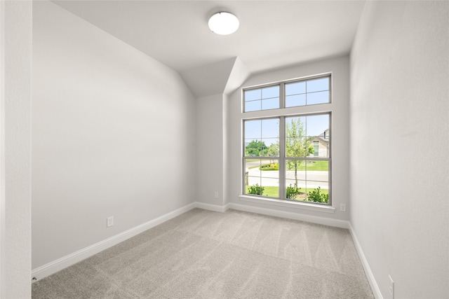 1402 Ethan Cir, Midlothian, TX 76065 - spare room featuring baseboards, carpet flooring, and vaulted ceiling
