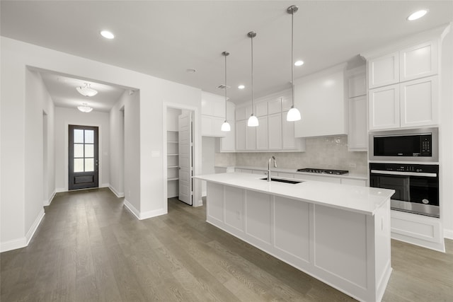 1402 Ethan Cir, Midlothian, TX 76065 - kitchen featuring oven, a sink, built in microwave, decorative backsplash, and white cabinetry