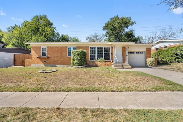 ranch-style house with a front yard and a garage