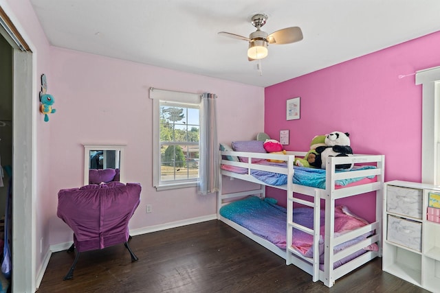 bedroom with ceiling fan and dark wood-type flooring