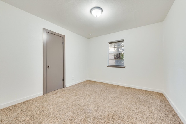 unfurnished room with carpet floors