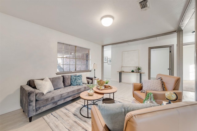 living room with light hardwood / wood-style floors