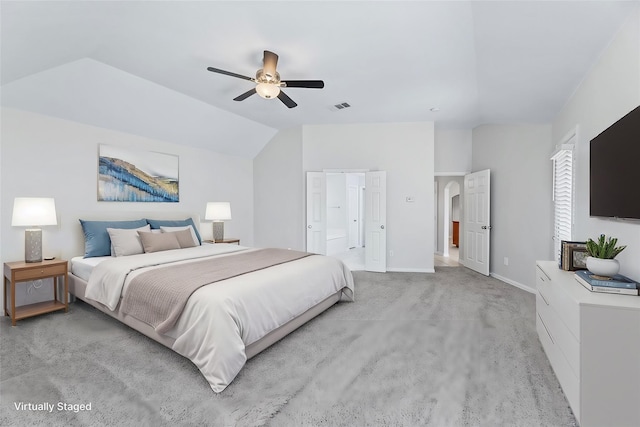 bedroom featuring ceiling fan, lofted ceiling, and light colored carpet