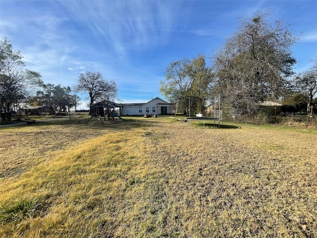 view of yard with a trampoline