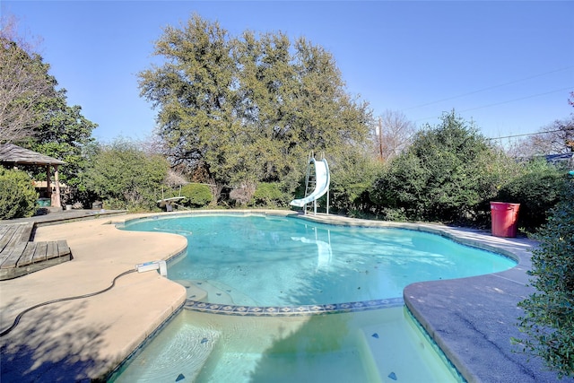 view of pool featuring a water slide