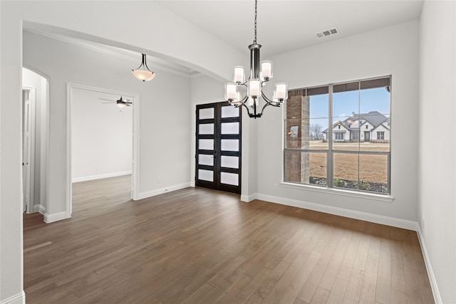 unfurnished dining area with dark wood-type flooring and ceiling fan