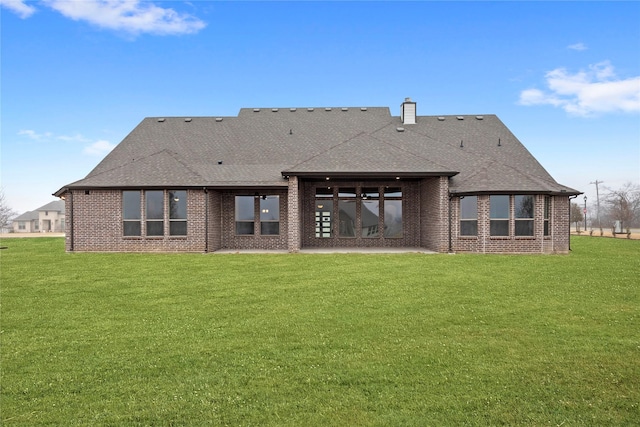 back of house with a lawn and a patio area