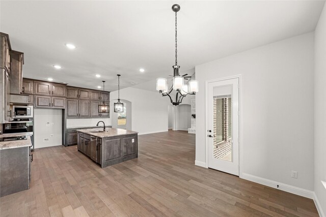 bathroom featuring tile patterned flooring, shower with separate bathtub, and vanity