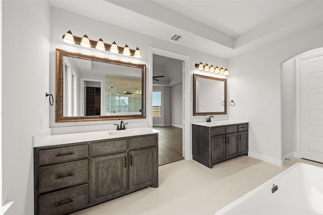 bathroom featuring vanity and separate shower and tub