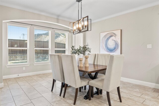 dining area featuring a chandelier, light tile patterned floors, and ornamental molding