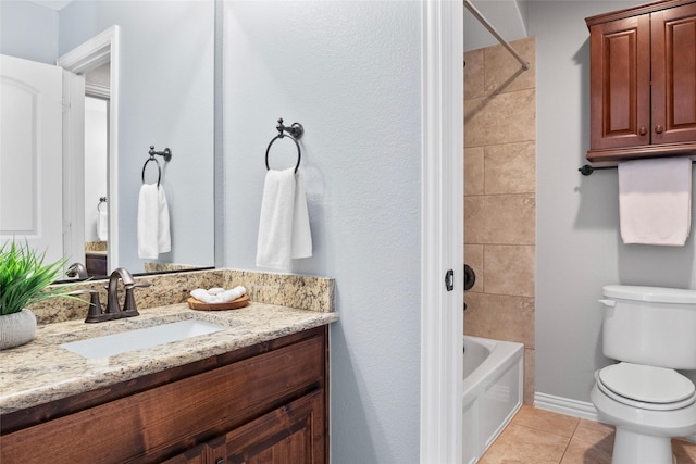 full bathroom featuring tile patterned flooring, vanity, toilet, and tiled shower / bath