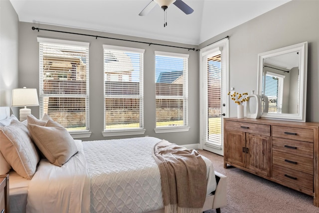 bedroom with access to exterior, multiple windows, light colored carpet, and ceiling fan