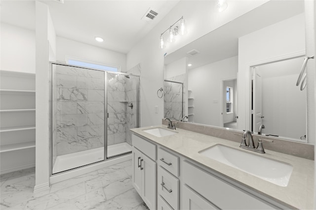 bathroom with vanity and an enclosed shower